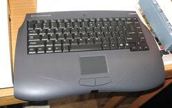 Gray computer with a keyboard