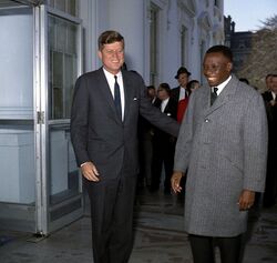 President John F. Kennedy Greets Prime Minister Cyrille Adoula of the Republic of the Congo (Leopoldville) (cropped).jpg