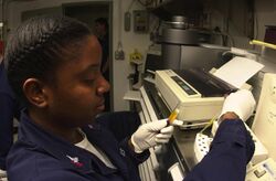 US Navy 030923-N-1577S-003 Hospital Corpsman 2nd Class Donna Sanderson from Lancaster, Calif., prepares serum cups.jpg