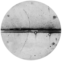 Curved arc shows a cloud chamber trajectory of a positron.