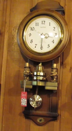 Rhythm Small World Dual Bell Ringers clock.png