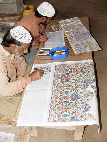 File:Correctional Activities at Central Jail Faisalabad, Pakistan in 2010 - Convict artists busy in drawing designs of carpets on graph papers.JPG