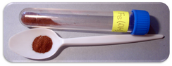 Samples of iron(III) oxide-hydroxide monohydrate in a vial, and a spoon
