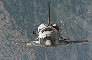 Space Shuttle Discovery (STS-114 'Return to Flight') approaches the International Space Station.jpg