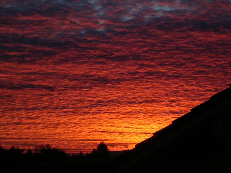 File:Bright red clouds at sun rise.JPG