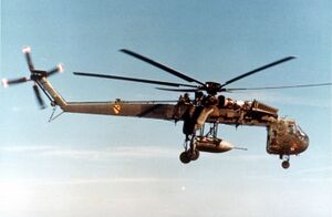 Sikorsky Skycrane carrying parachute bomb c.jpg