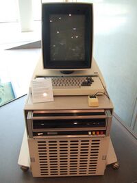 Computer with keyboard and monitor on top