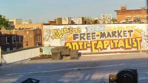Graffiti reading "Free-market anti-capitalist"
