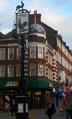 Inn sign above historic crossroads, SUTTON, Surrey, Greater London.jpg