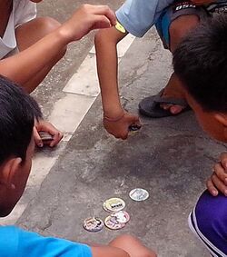 Kids playing pogs.jpeg