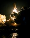 The space shuttle Endeavour launches on STS-89, lighting up the night time sky on its way to Mir.