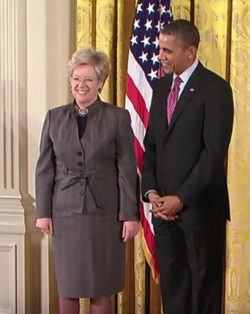 Dr. Sandra Faber as a National Medal of Science laureate for 2011. At the presentation ceremony with President Barack Obama of the U.S.A. in 2013.