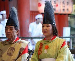 Shinto priest and priestess in Japan.