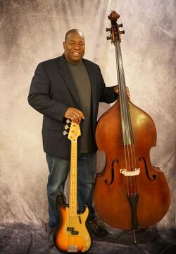 Alex Dixon with his Upright and Bass Guitar.jpg