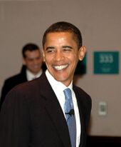 On the left: an image of Barack Obama in a black suit.
