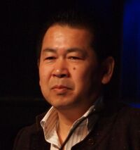 A photograph of Yu Suzuki