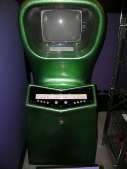 Green arcade cabinet with two sets of controls