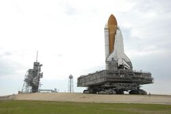 The Space Shuttle moving to the launch complex on a crawler-transporter