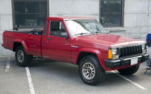 1989 Jeep Comanche Pioneer 2WD in Colorado Red, front right.jpg
