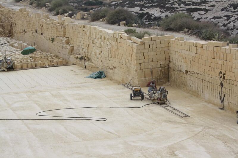 File:Gozo, limestone quarry - cutting the stone.JPG