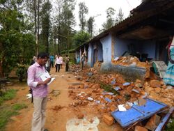Tracking elephant damages to a residential colony by NCF team in the Valparai region.jpg