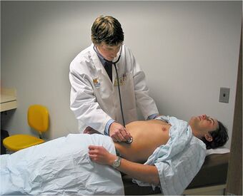 Standardized-Patient-Program-examining-t he-abdomen.jpg