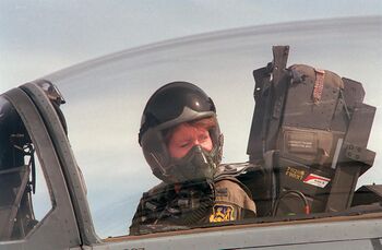 A close up of 1st Lt. Jeannie Flynn, the first F-15E female pilot, sits in the cockpit as she performs engine star.