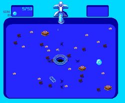 A horizontal rectangular video game screenshot that is an overhead view of a digital representation of a blue sink with a drain in the center. Scattered in the sink are brushes, razors, ants, crumbs, and grease. A small, light blue bubble is located to the right of the drain.