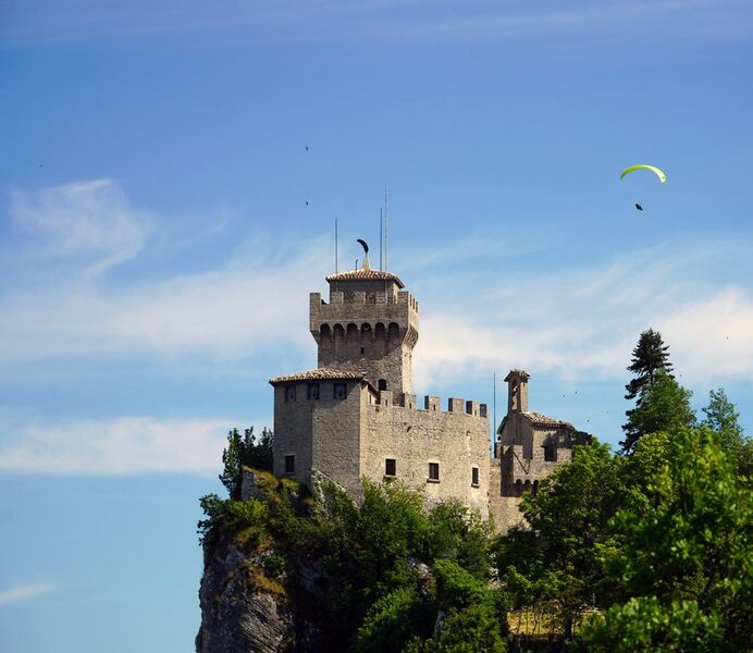 File:Second Tower in San Marino and Paragliding.jpg
