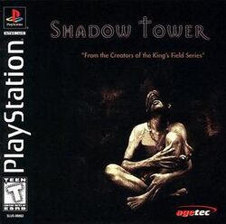 Artwork of a square box. Depicted is an apparently undressed man, with a piece of dark brown fabric covering his eyes and a big necklace around his neck. He sits with his legs crossed, his arms around them, and looking up. The top portion reads "Shadow Tower" in uppercase black letters with a slight gothic style and a white glow around them.