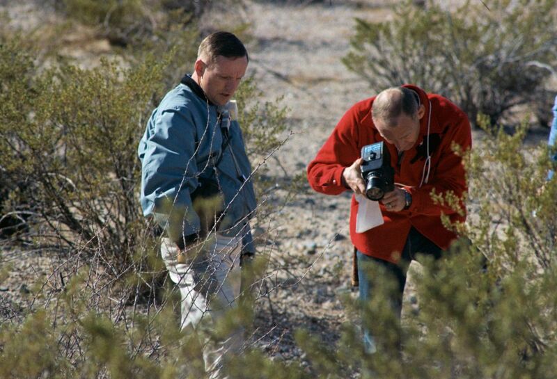 File:Neil (left) watches Buzz take a documentary photo of a sample.jpg
