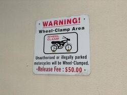 Wheel Clamp warning sign Singapore.jpg