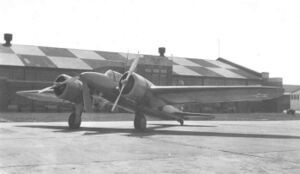 Curtiss YA-14 in front of hangar.jpg