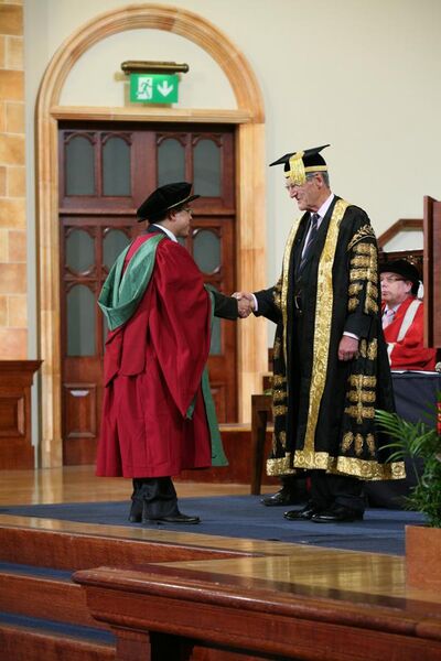 File:PhD graduand shaking hands with Sir Dominic Cadbury, the Chancellor of the University of Birmingham - 20120705.jpg