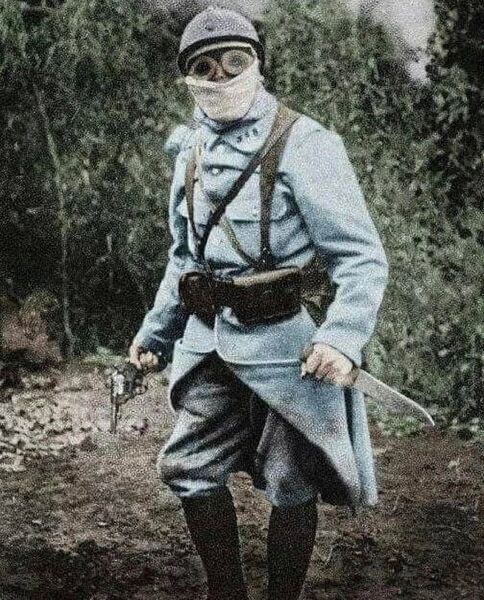 File:French Soldier ("trench cleaner") with a Chamelot Delvigne revolver, primitive gas mask (in this case a cloth mask and goggles soaked with chemicals) and dagger (1915, colorized).jpg