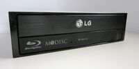 The M-DISC "swirl" logo on an LG Blu-ray optical drive