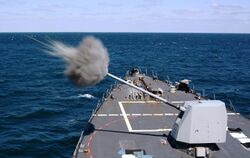 USS Mason conducts a live-fire exercise. (26302474161).jpg