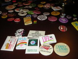 An image of an array of LGBTQIA+ buttons of varying sizes and colour.