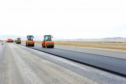 Rollers compact the asphalt layer. Buryatia, Russia.jpg