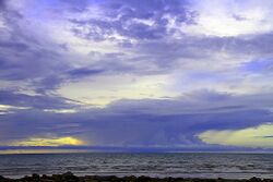 Wet season storm at sunset from Rapid Creek Mouth, Darwin.jpg