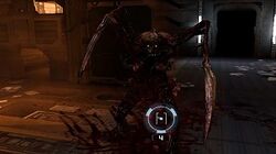 A character in first-person shoots at a monster in a darkened corridor.