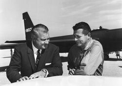 Kelly Johnson and Gary Powers in front of a Lockheed U-2IU-2 plane.