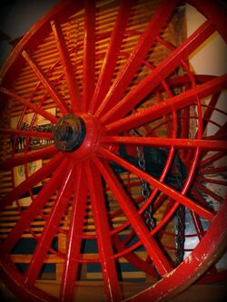 Red logging wagon wheel.jpg