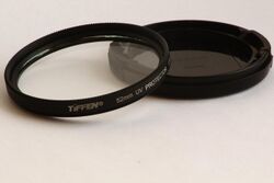 Tiffen 52mm UV filter with lens cap.JPG