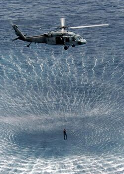 US Navy 050419-N-5313A-414 Search and Rescue (SAR) swimmers attached to the Kearsarge Expeditionary Strike Group conduct search and rescue training during routine helicopter operations.jpg