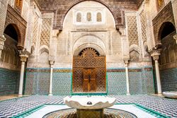 Interior facade of Al-Attarine Madrasa, showing ornate decoration