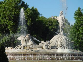 Fountain with statue of Neptune atop a two-horse shell chariot with a water wheel