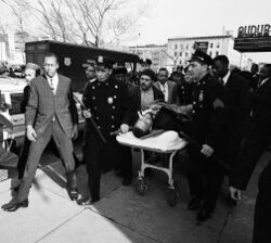 Malcolm X on stretcher.jpg