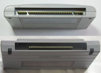 A photo showing the bottom ends of a PAL SNES / Japanese SFC cartridge and a North American SNES cartridge.