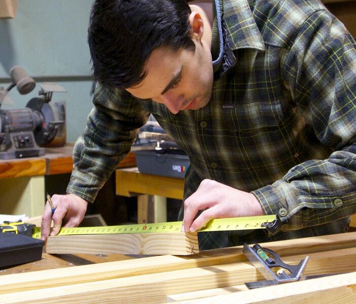 File:American College of the Building Arts junior measuring for a custom stair.jpg